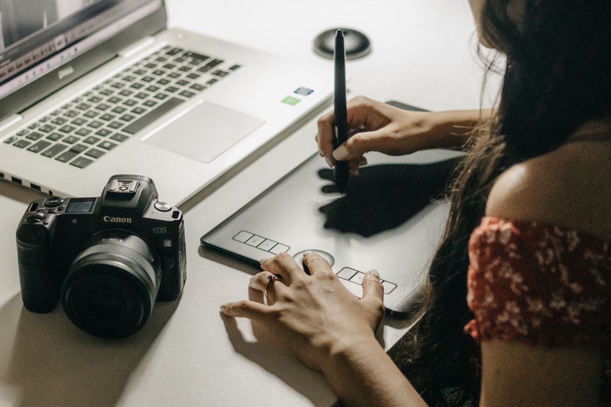 Designer sketching on a drawing tablet